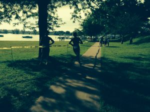Teammate Devon Palmer cheering from the shadows as I run out of transition