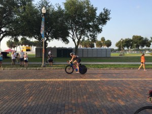 Slowing to dismount on the bricks.
